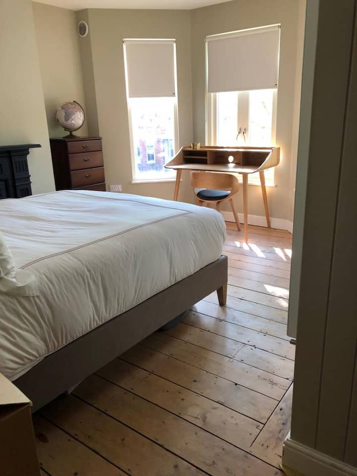 This is the main bedroom with a large double bed. It also has an en suite bathroom with wet room shower in similar design to main bathroom