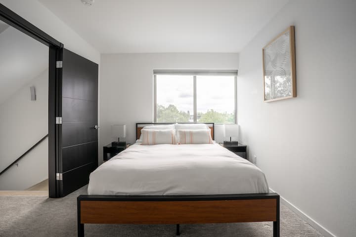 Bedroom 4 queen-sized bed with bedside tables