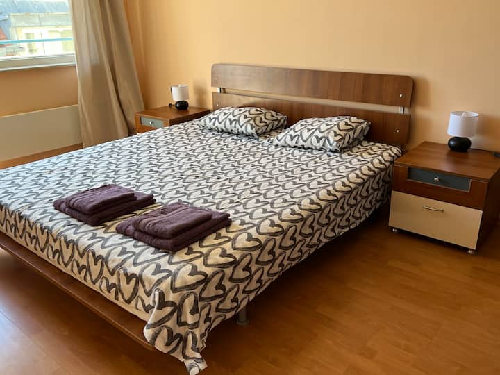 Bedroom with a king-size bed and two large wardrobes. Private balcony.