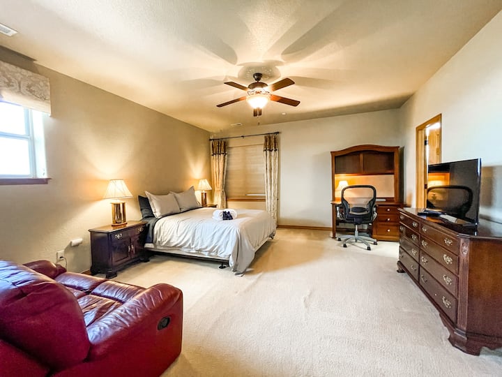 The upper-level master suite 2 features a desk, walk-in closet, and full bath.