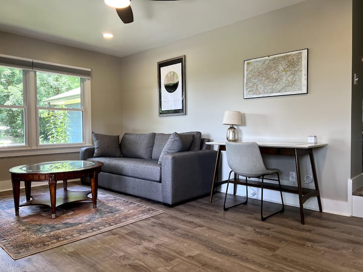 Second living room area with desk for remote working. This room is also an additional sleeping room with a queen size pull out couch.