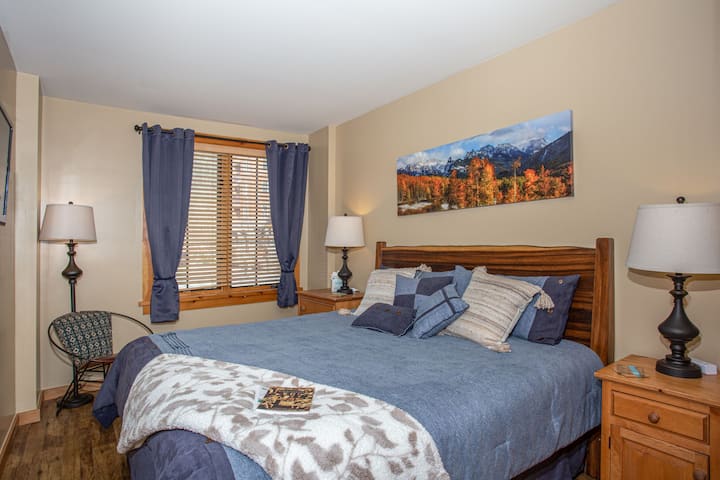 Want to sleep in? You'll LOVE the room darkening curtains.    Find USB-C and USB-A charging stations as well.

Primary bedroom with ensuite bathroom.
