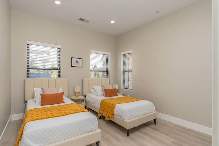 2 very comfortable XL Twin in the bottom floor bedroom with a closet .