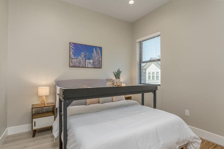 2nd bedroom upstairs furnished with a very comfortable queen bed , rollaway work desk if you feel like working on your bed.