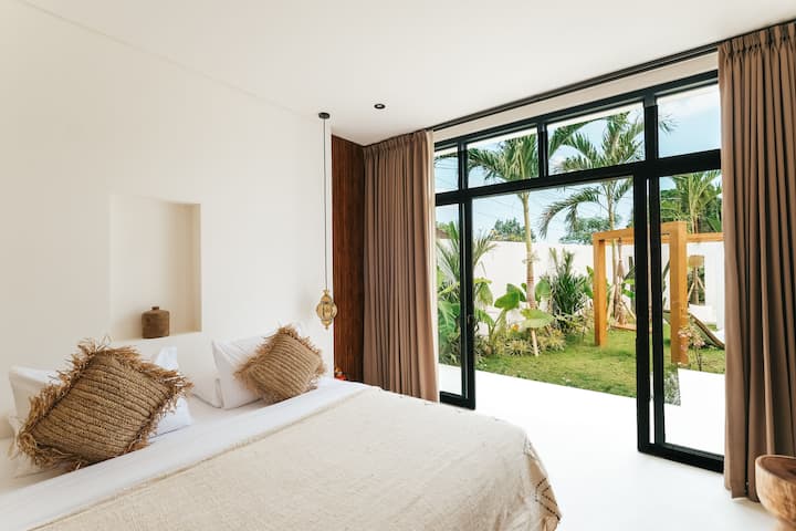 minimalist bedroom with garden view