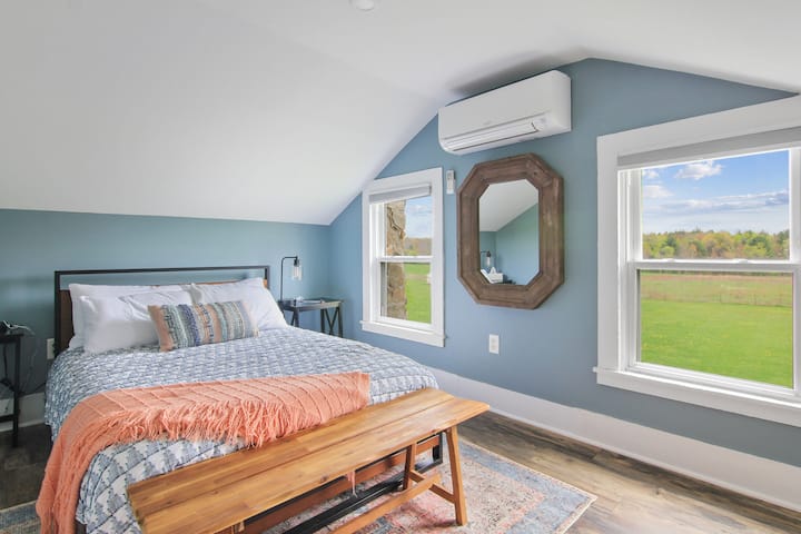 Cozy bedroom with full sized bed, room darkening shades, LED lamps w/USB ports, a dresser and 2 windows overlooking the backyard.