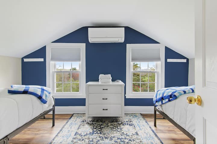In this bedroom, you'll find two comfy twin beds, a dresser and room darkening shades.