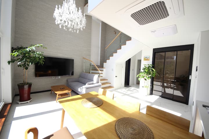 A beautiful and luxurious single-family home with a nice chandelier and living room window