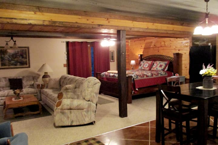 The main room... alot of comfortable furniture to sit and relax and a king size bed when the day is done. 