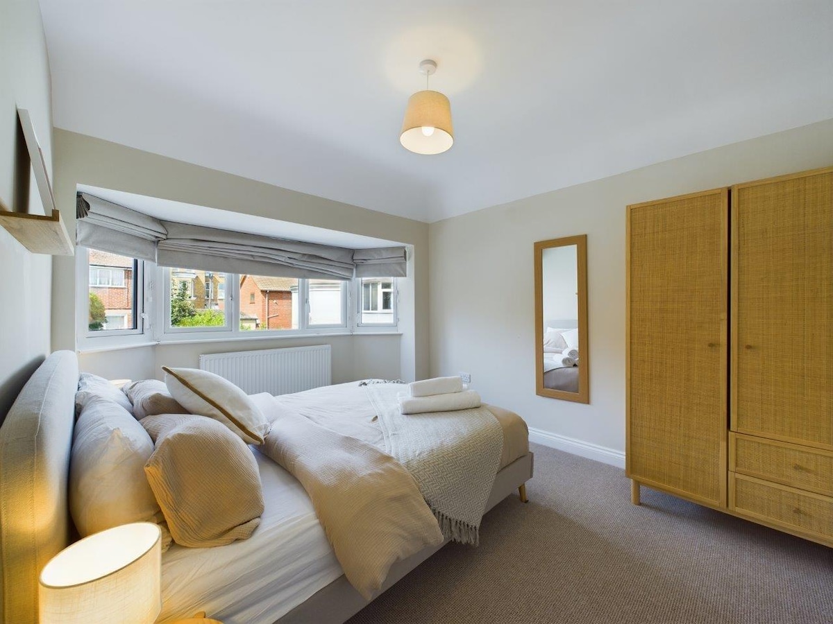 Rear bedroom with king size bed chest of draws, wardrobe and bed side tables 

#beach