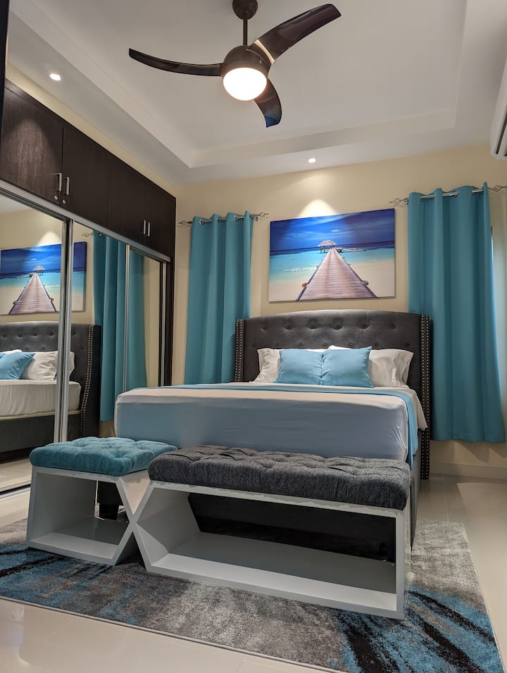 Dive into our Ocean Suite Queen Bedroom.