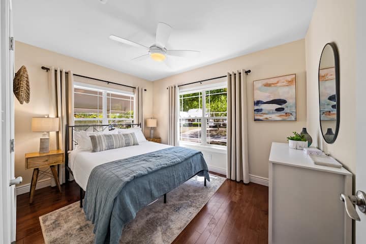 Bedroom 4, located at the front of the house, features large windows and a queen bed. Keep an eye out for Hill Country deer passing by! A peaceful retreat after exploring Kerrville's wine trail and downtown.