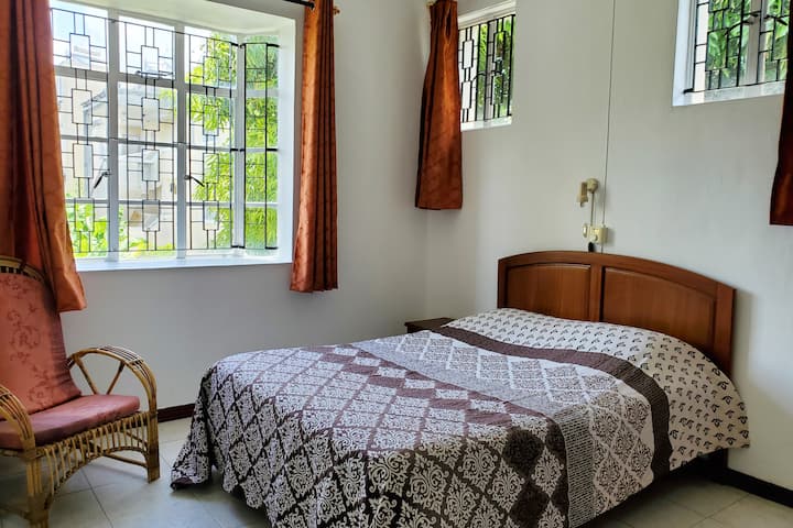 Second bedroom (fan and air conditioning) overlooking beautiful garden