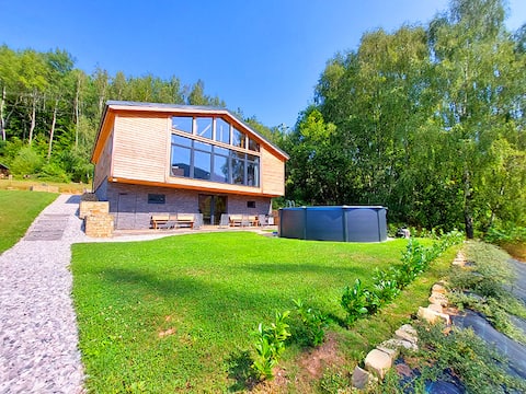 Recreational wellness house with a hot tub and a summer pool
