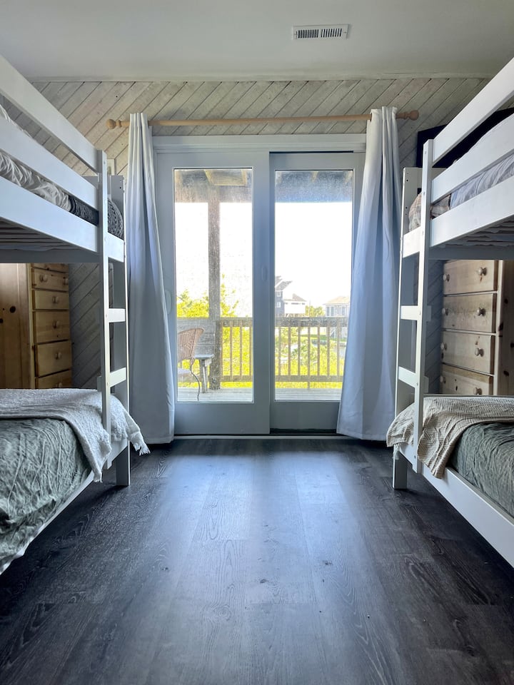 Bunk room with access to deck
