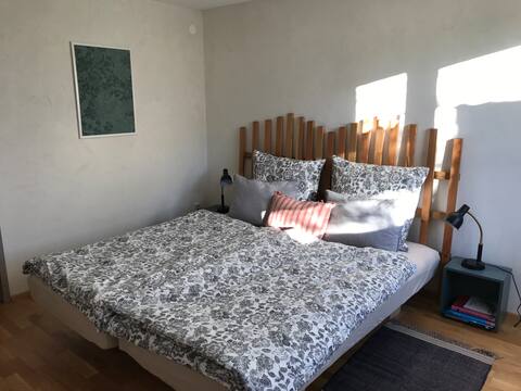 Cozy bright guest room with meadow view...