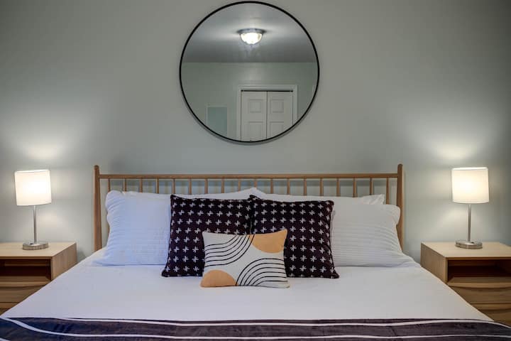 The Master King en suite is on the main/2nd floor. Enjoy memory foam mattresses and crisp, white cotton sheets throughout the home. This room: two closets, dresser, nightstands w/ storage, extra hooks, Roku TV, USB port lamps, full-length mirror