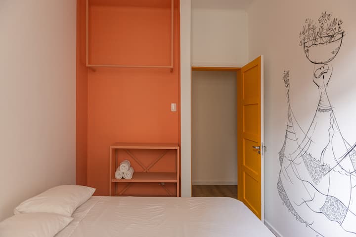Bedroom 1 en-suite with a double bed and a ceiling fan