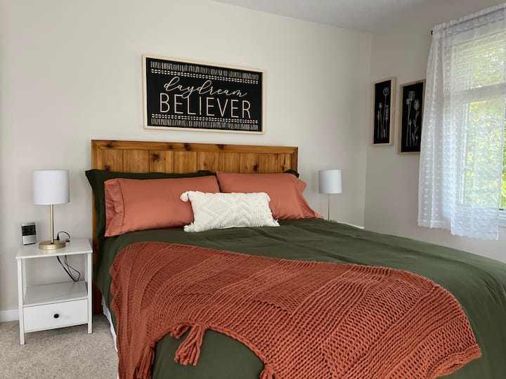 Large Master Bedroom with queen bed, walk-in closet, and Roku Smart TV.