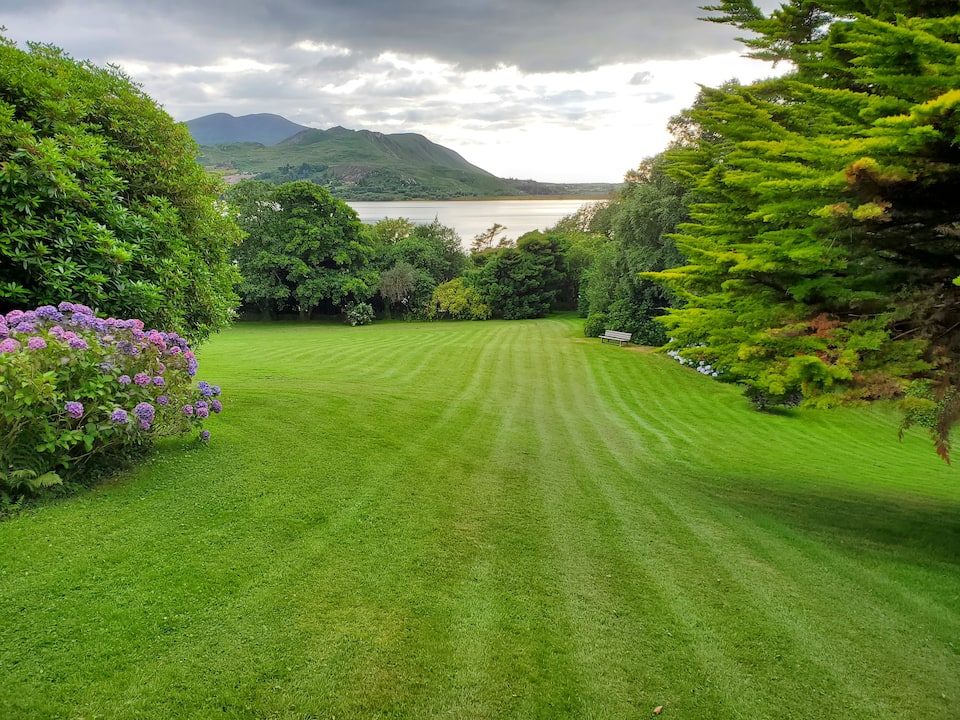 A whitewashed cottage in four acres of gardens on Caragh Lake, Killorglin, County Kerry, Ireland, photo 1 of 10