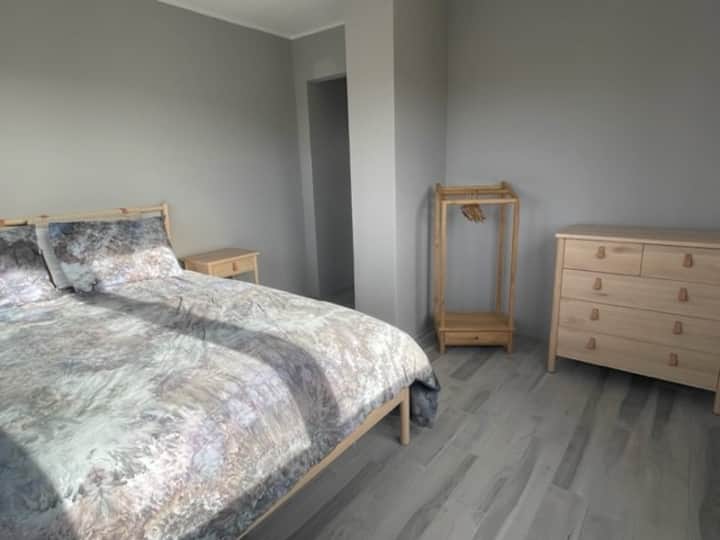 Bedroom 5 with Ikea queen bed set and view to the Aruba hills and back yard.