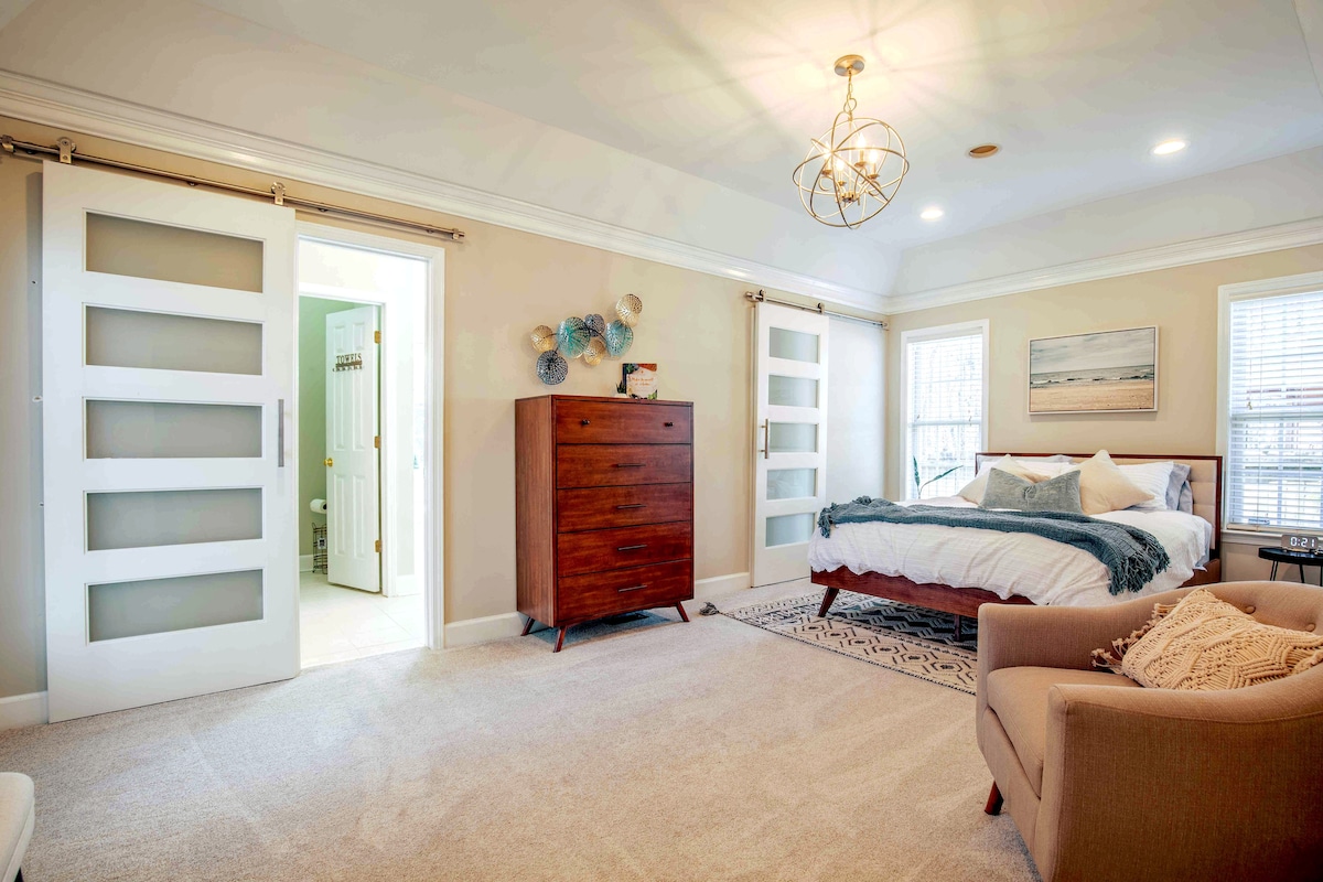 Master retreat with tv, jetted jacuzzi tube and large his and her closets.