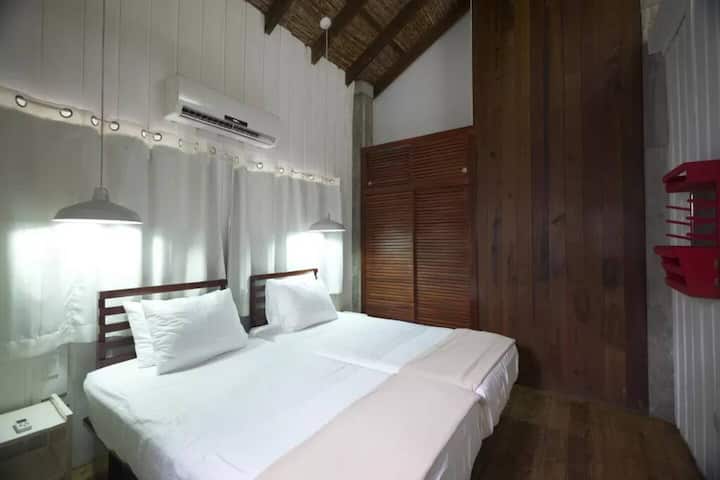 Room #3 Two single beds.  
Air Conditioning.  
Ceiling fan
Closet.  
A safety deposit.