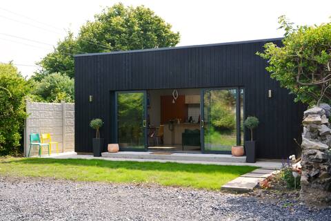 Newly renovated railway cottage beside the sea.
