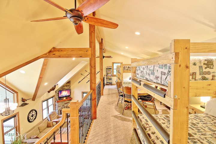 Our vaulted ceiling loft bedroom area features tons of natural light and 6 full beds (3 bunks) along with a game table and all the classic board games!
