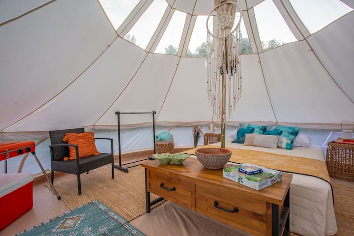 Interior of tent looking left to see large Igloo Cooler to store food and drinks in, and Gas BBQ Grill for outdoor use only.