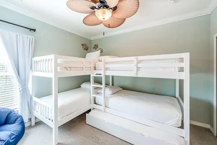 The bunk room features 2 bunk beds and 1 pull-out trundle making it sleep 5. Perfect for kids or young adults.