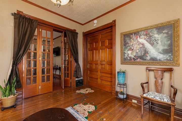 Peacock room in the Grey Gables. Pocket door and French doors with black-out drapes make this a private room if desired. The couch is a queen size sleeper.
