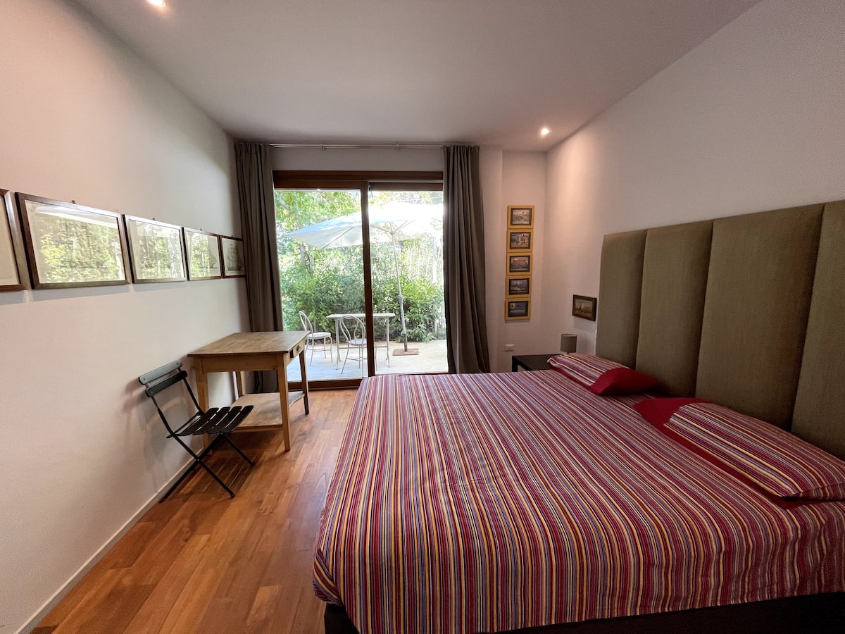 The bedroom — double bed, parquet