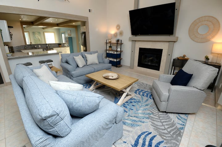 Living room with 75 inch smart TV. 