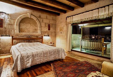 stone house with fireplace and terrace, balloon view
