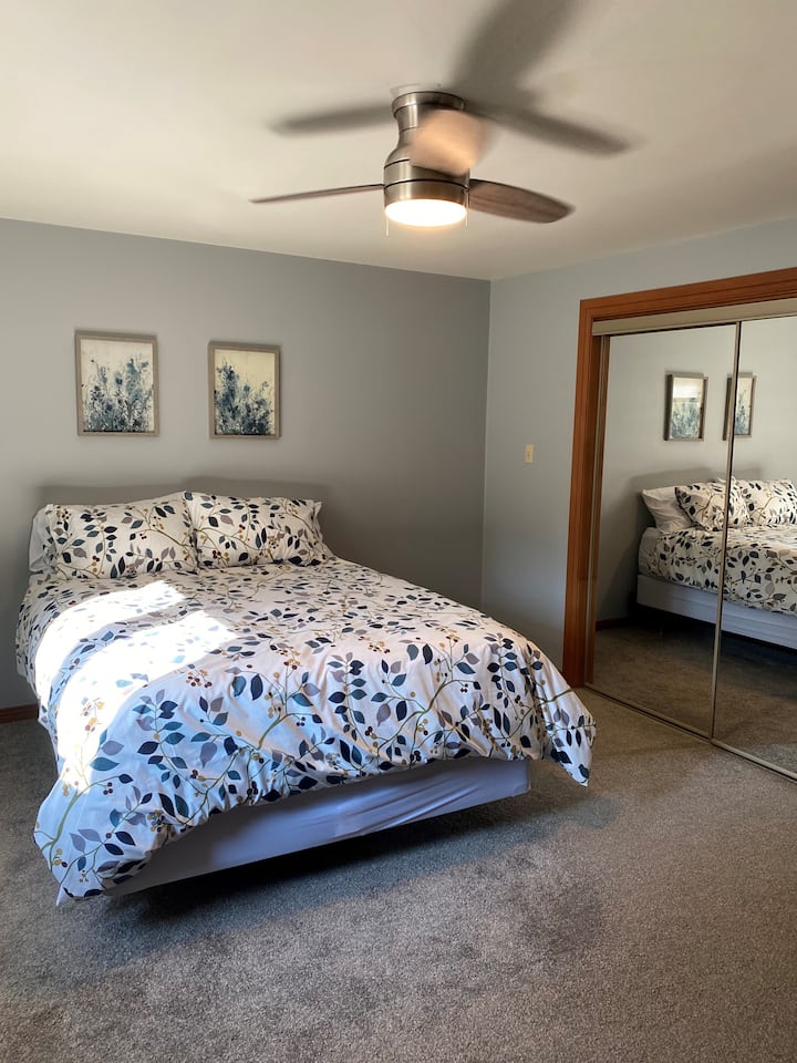 Spacious master bedroom with queen bed, lots of storage and its own tv.