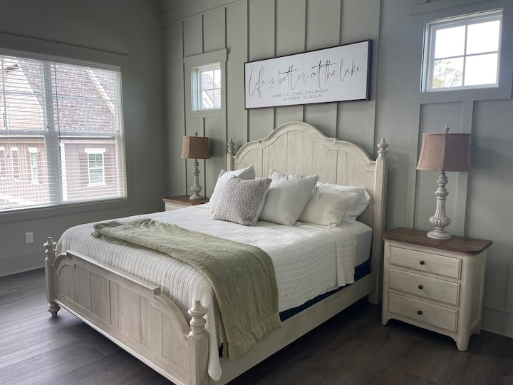 The Master on the main level share lakeviews and double doors out on the patio for see the beautiful morning view!