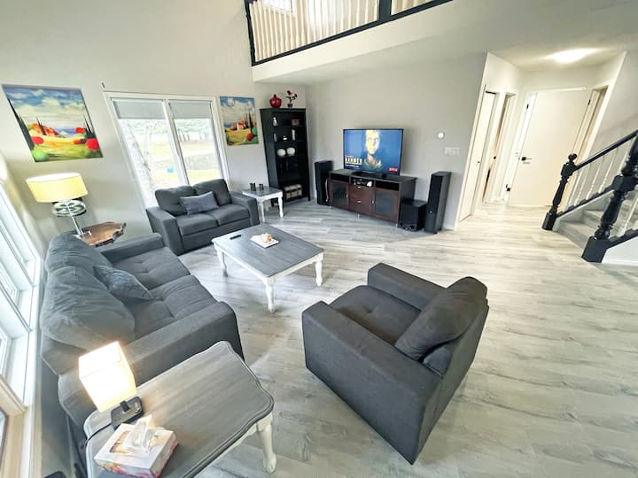 Nestle into this comfy couch with a good book or your favorite show. The living room’s open layout and warm light make it an inviting spot for both quiet moments and socializing.