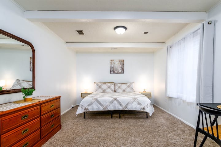 Bedroom 1: Spacious master bedroom boasts a king size bed, dimmable touch-on lamps with USB ports, private work station, and an attached half bath!