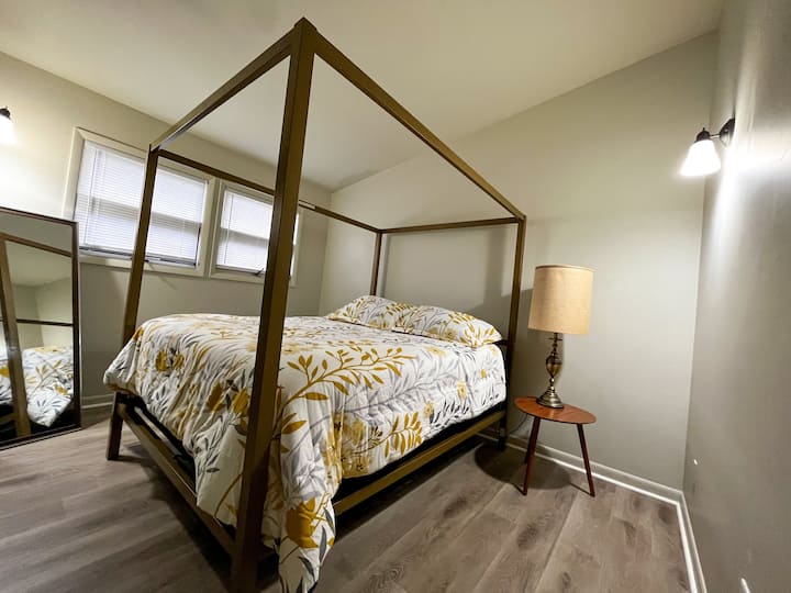 Queen size, gold canopy bed is as comfortable as it is tacky.
