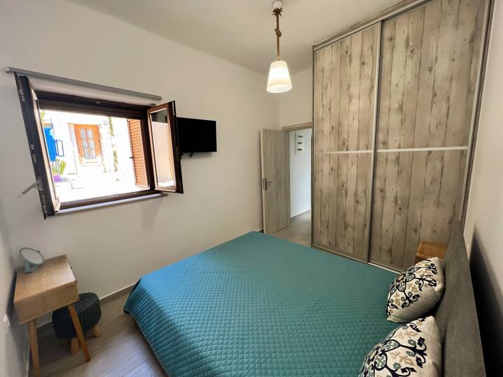 The biggest bedroom, with TV, wardrobe and aircondition cooling/heating