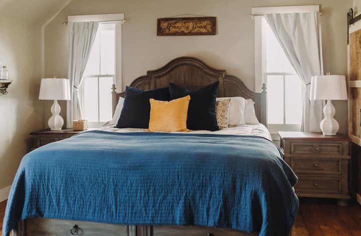 You'll want to sleep in after a comfortable night's sleep thanks to this Sleep Number King mattress & black out curtains. The nightstands and under bed storage offer space for unpacking your suitcases so you can settle in.