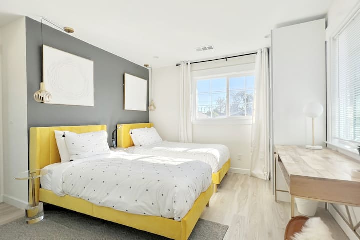 Bedroom #3, two single beds, work desk,  lounge chair, custom designed wardrobes with built-in drawers, pull-out tray, basket, shelves and hanging rod, ensuite bathroom