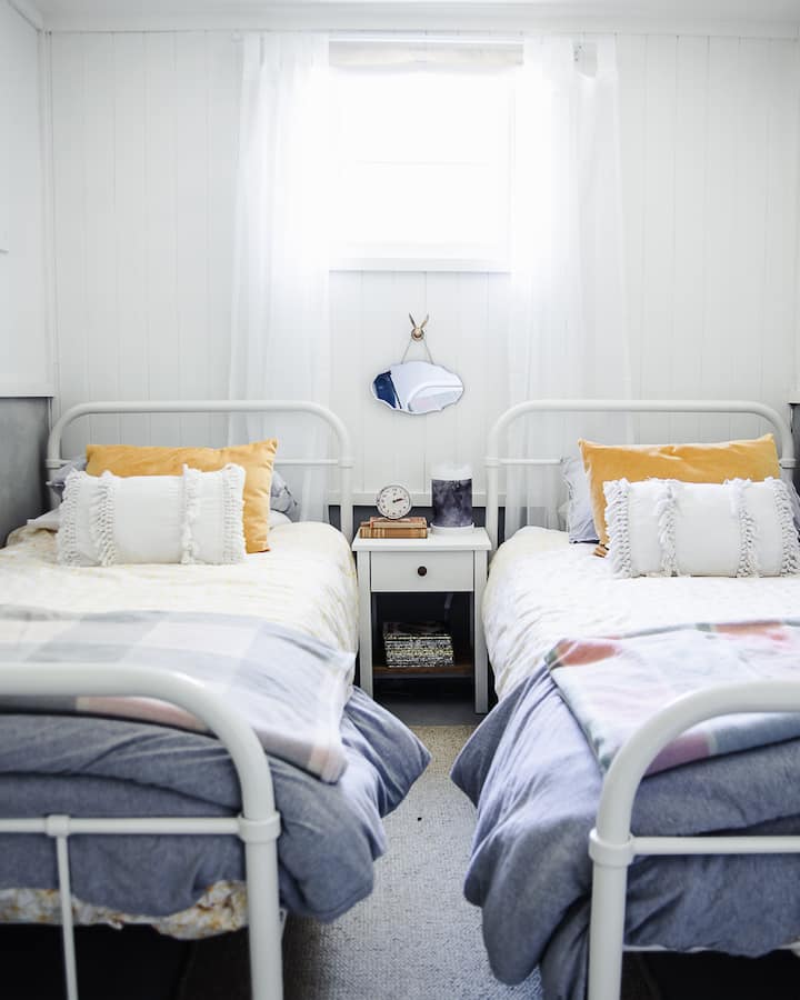 Two single beds in the second space, which is the original milking room of the dairy, (it is open to the living room but separated from the master suite).