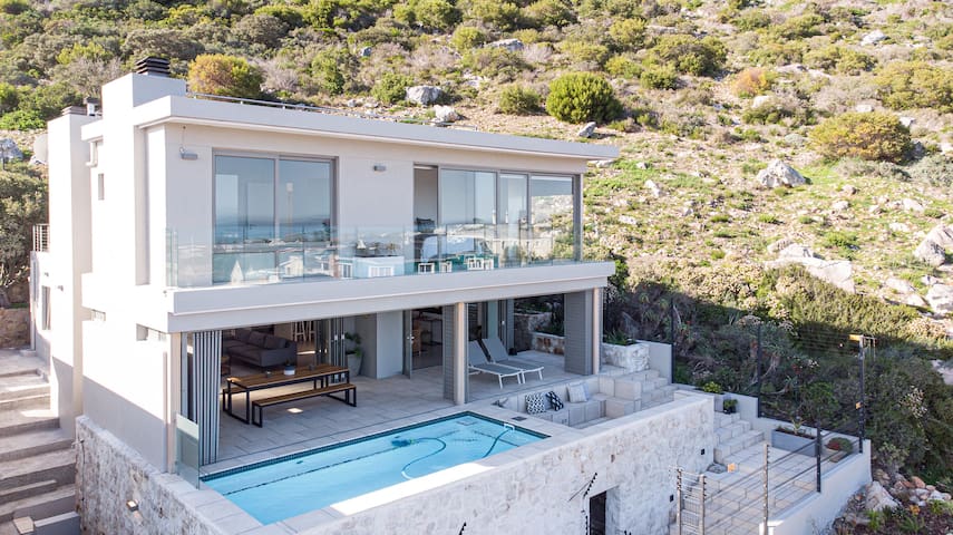 Modern seaside home with panoramic views.