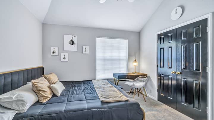 bedroom 2 w/ King bed with private desk and closet