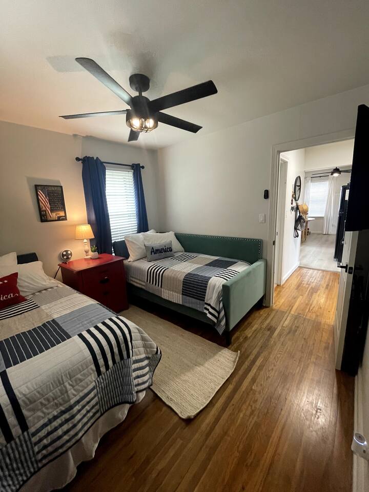 The second bedroom offers two plush Single beds, remote operated ceiling fan, light & A/C- heater window unit, a 32' HD tv,Nintendo Nes, books, games & Black Out Curtains.