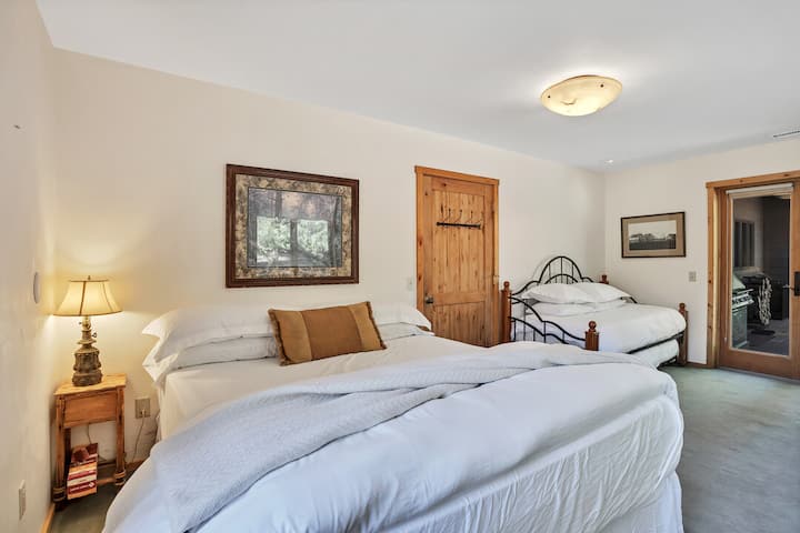The second bedroom on the main floor features a California King bed, as well as a twin and trundle twin, and sleeps four comfortably.
