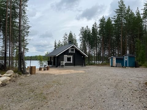 Beach cottage and sauna on a clear-water lake.