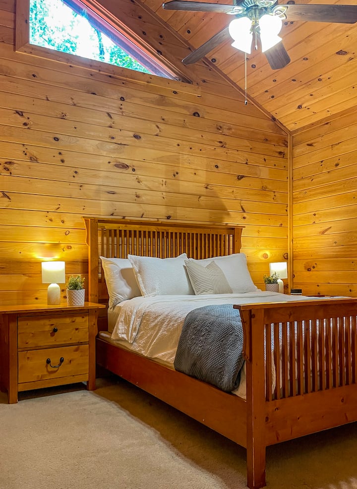 Queen Guest Bedroom with smart tv and lots of natural light. 